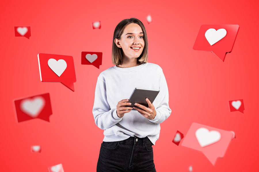 Smiling teen girl with tablet, social media